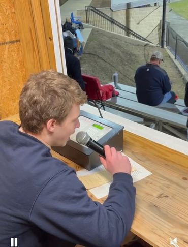 Brody Fisher announcing at the varsity baseball game for The Weber School