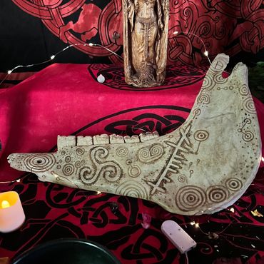 Hand Carved bone horse jaw with ogham script and cup and ring designs.