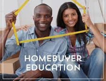 Happy couple holding a picture frame of a home with the title of home buyer education underneath