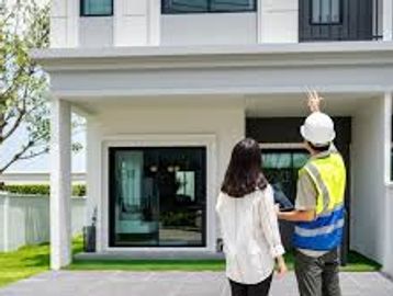 Home inspector explaining his findings to the potential new home buyer