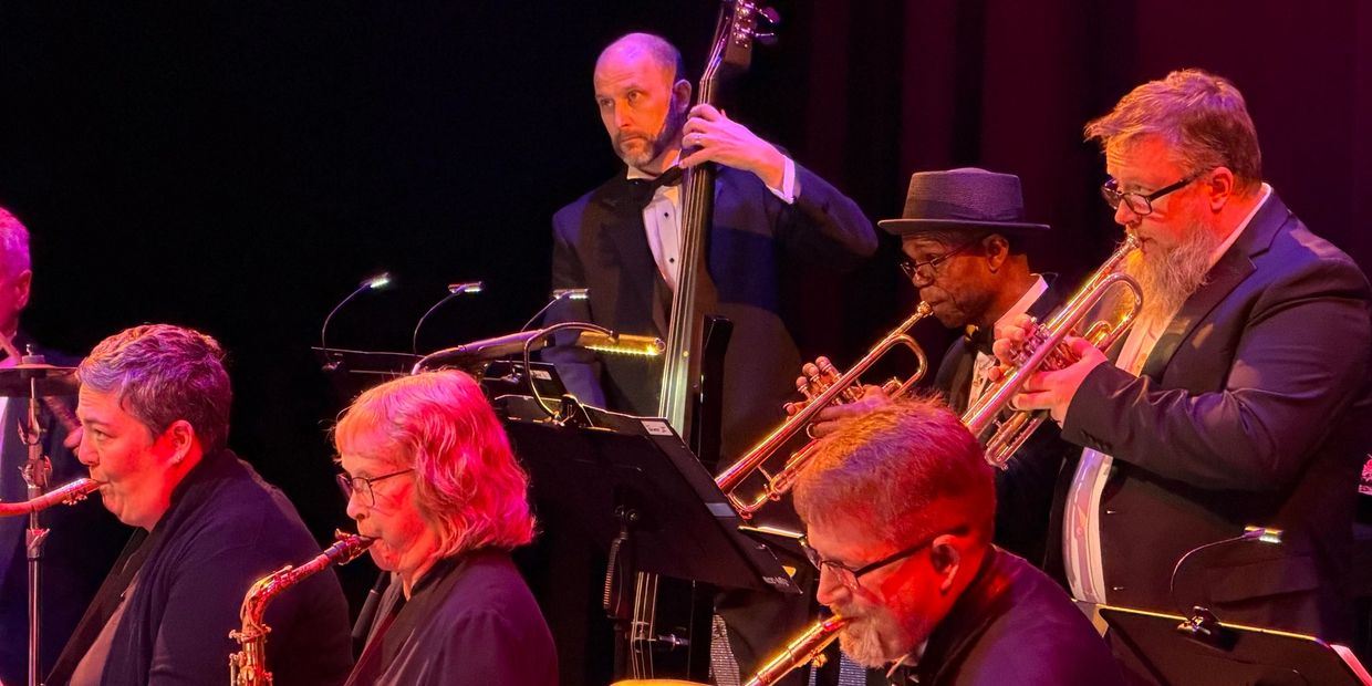 Jazz band performing on stage with various instruments.