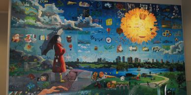 A wall-sized mosaic mural of a girl, landscape and pathway made for the Burnaby Hospital in BC
