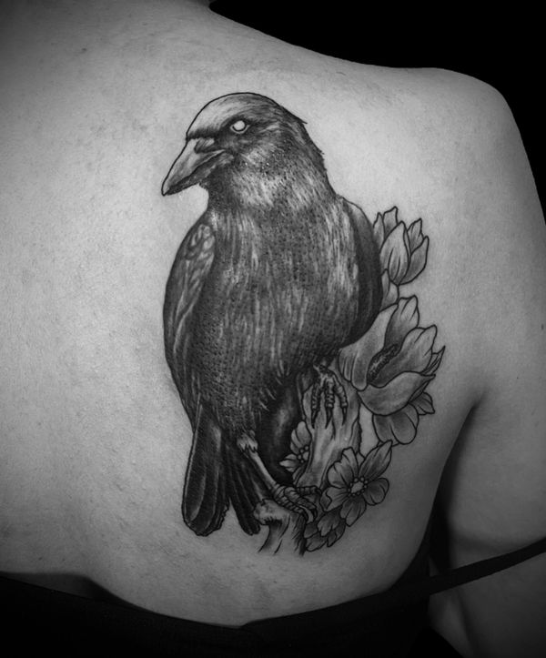 Illustrative raven and flowers tattoo