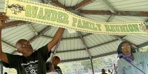 Quander family members under a pavilion at the 98th family reunion
