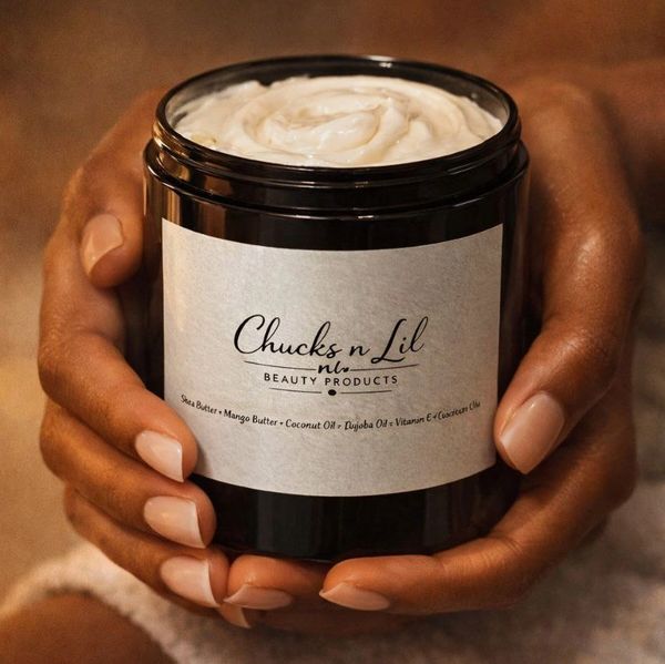 Hands holding a skincare jar labeled Chucks n Lil Beauty Products, made for melanin-rich skin.