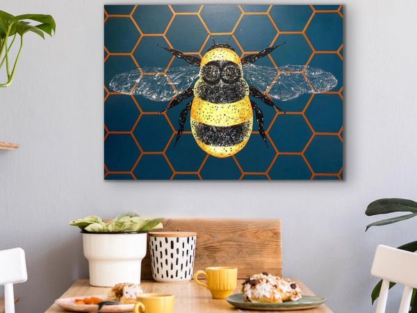 bee painting on the wall in the kitchen