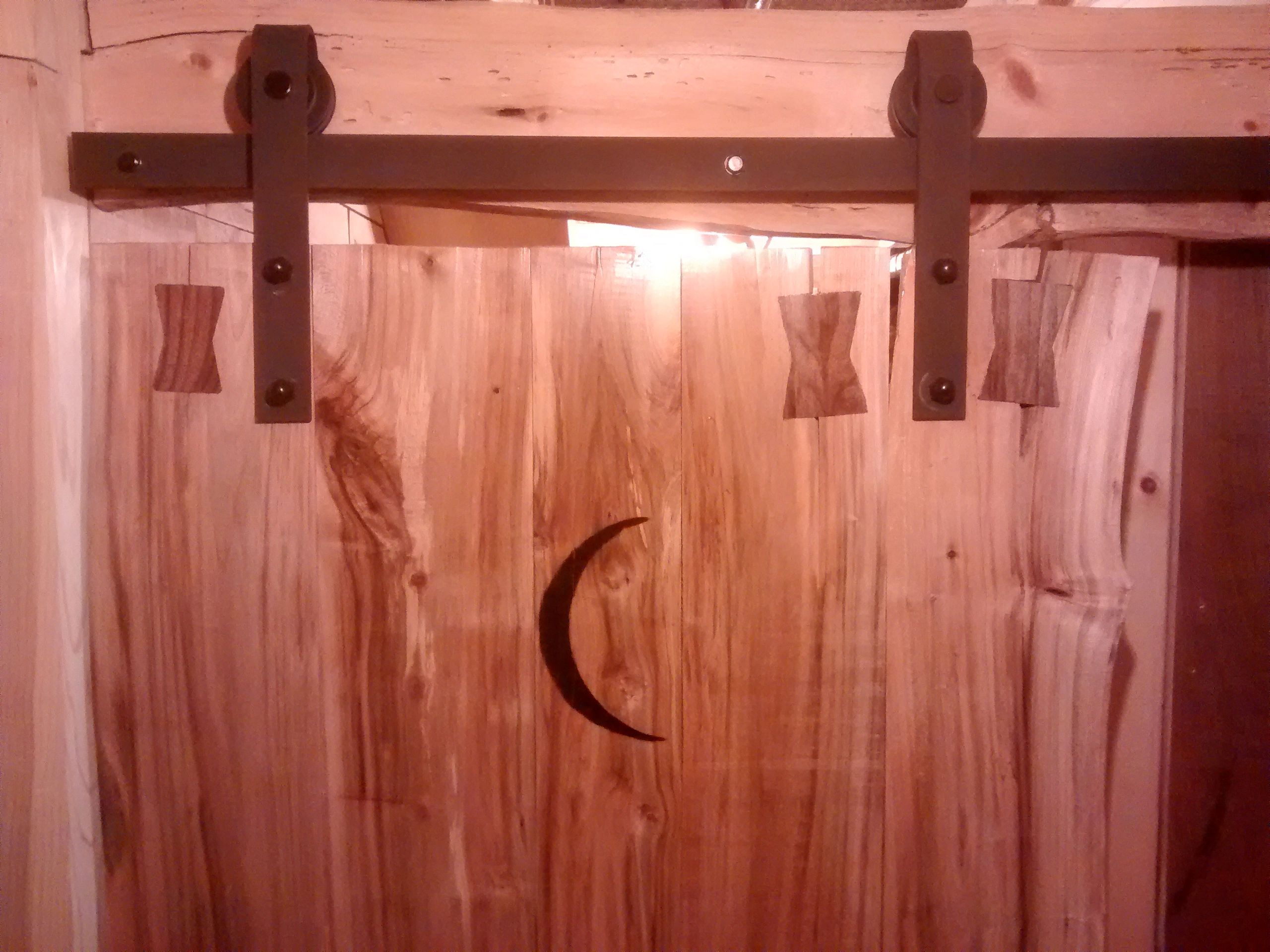 Cuustom live edge soft Maple restroom sliding barn door.