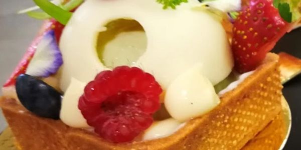 Elegant fruit tart with pistachio dome, fresh berries decorationss and edible flowers. We start from teh basic and then we build up to advanced pastry skills.