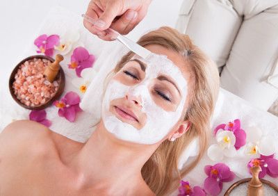 Woman receiving a luxurious facial