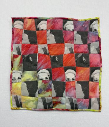 Colorful patchwork fabric with mixed faces and abstract patterns.