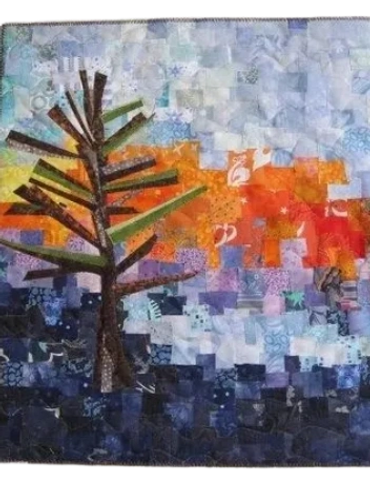 Collaged commercial fabrics, machine quilted