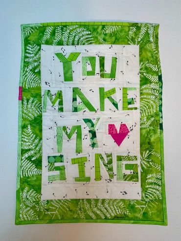 You Make My Heart Sing. Improv piecing. Machine quilting.