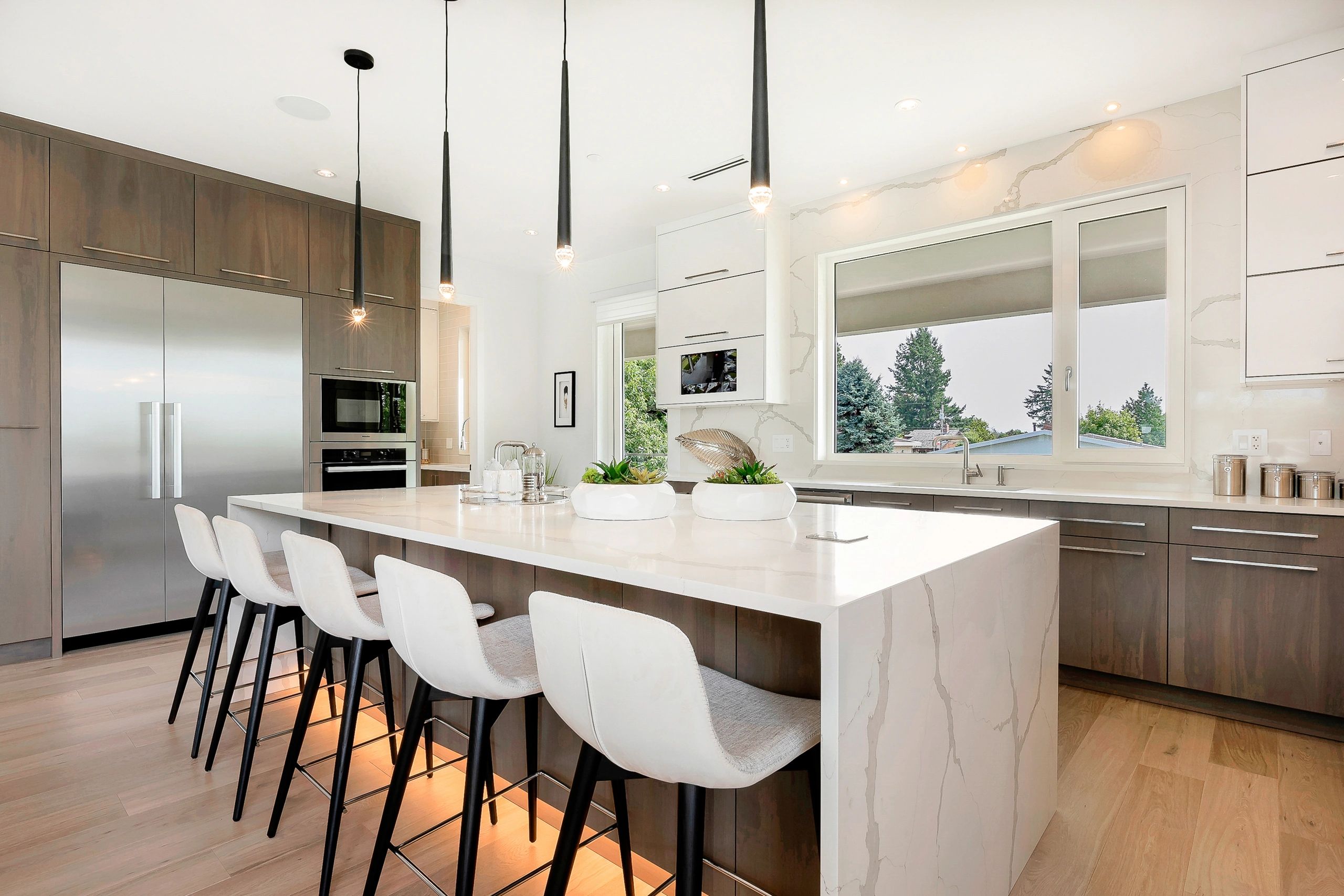 White oak stained cabinetry and white kitchen cabinets in a luxury designed kitchen renovation