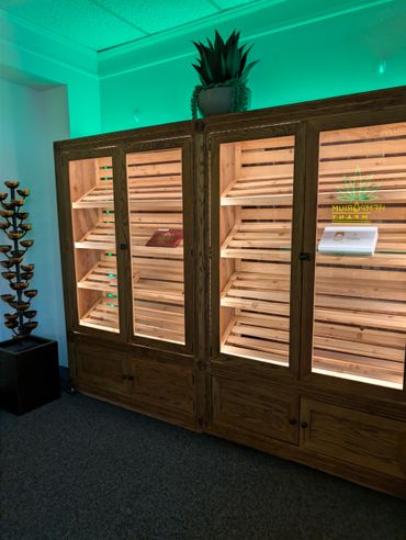 Empty wooden display cabinets with ambient lighting in a modern room.