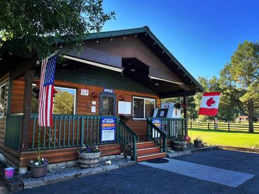 Camp store with American flag and Canadian flag