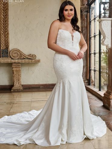 satin and lace strapless mermaid dress on a size 20 model