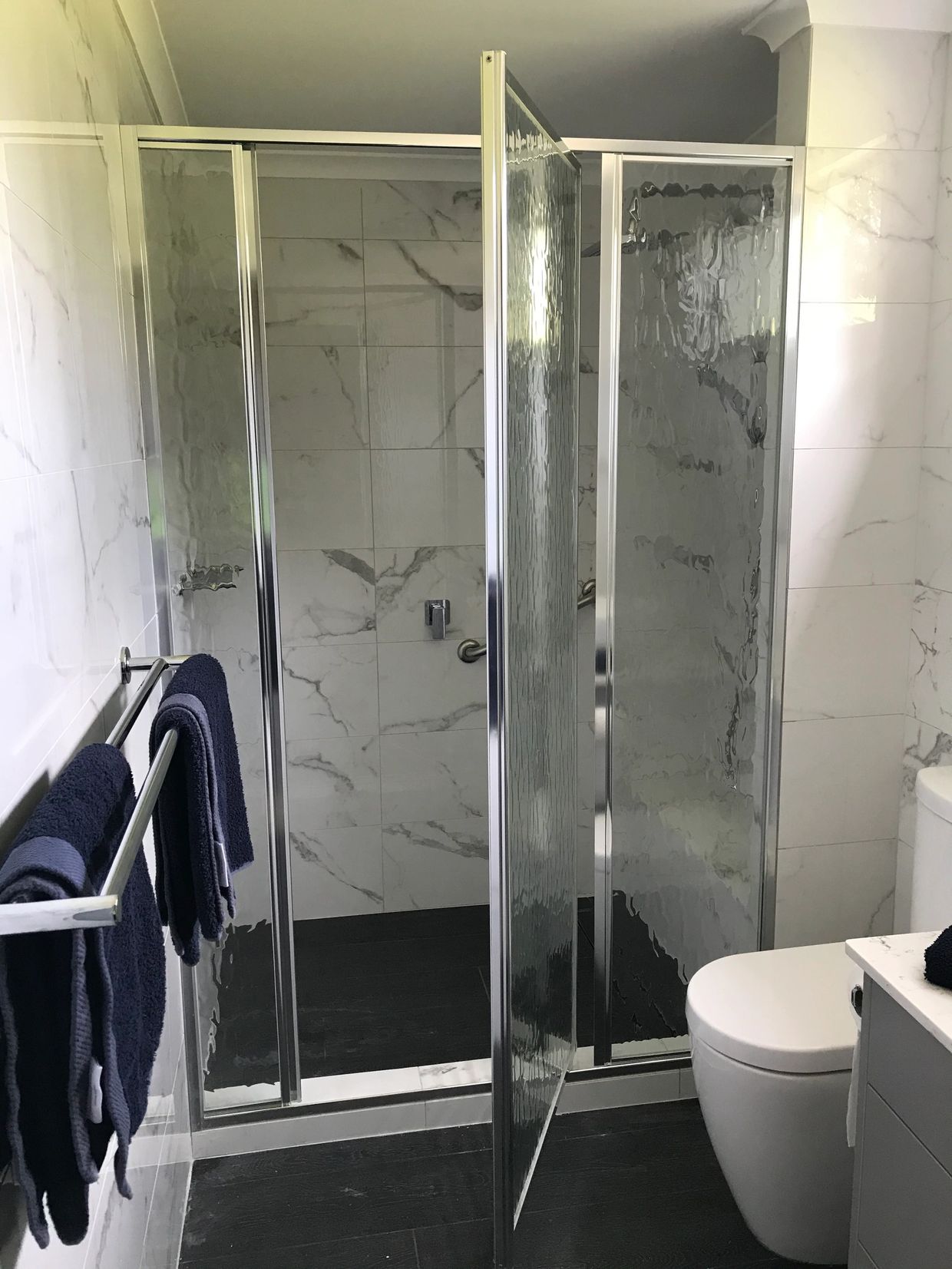 Custom made fully framed shower screen with textured glass