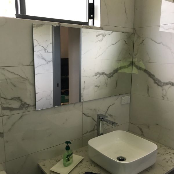 Bathroom mirror fixed with chrome plated mirror clips