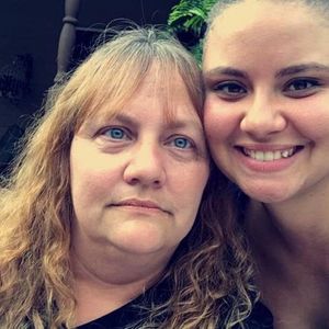 Our Lice Technician, Michelle, Smiling With Her Daughter