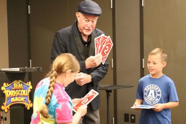 Performing magic for the library summer reading program