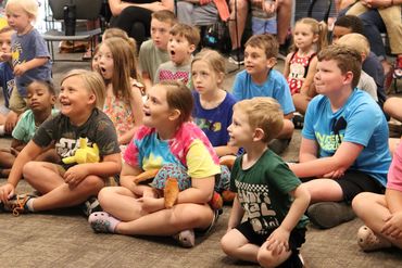 Performing magic for the library summer reading program