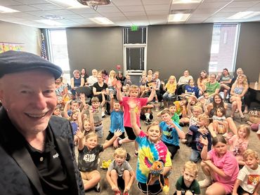 Performing magic for the library summer reading program