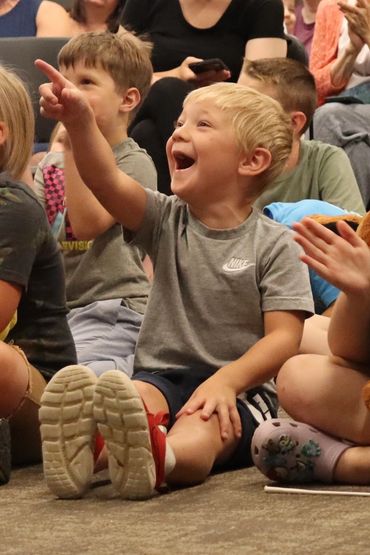 Performing magic for the library summer reading program