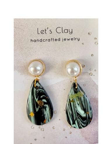 Elegant handcrafted earrings with pearl tops and marbled clay drops.