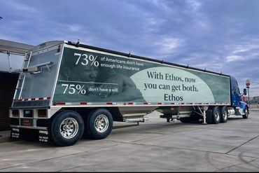 Truck trailer advertisement highlighting life insurance and wills with Ethos.