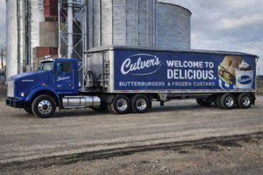 Blue Kenworth truck with Culver's advertisement for butterburgers and frozen custard.