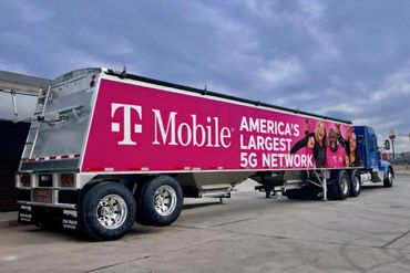 T-Mobile truck with advertising for America's largest 5G network.
