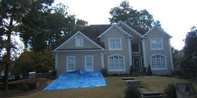 Tarps to prevent damage to the house and landscaping.