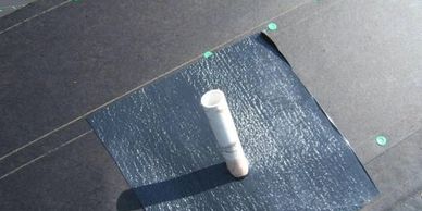 Weather watch applied around a plumbing vent stack.
