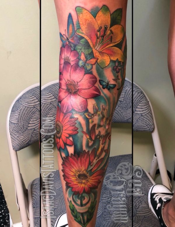 Flowers leg sleeve tattoo; she wanted to cover some varicose veins 