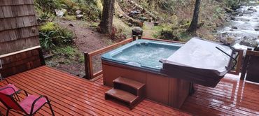 hot tub on deck above river