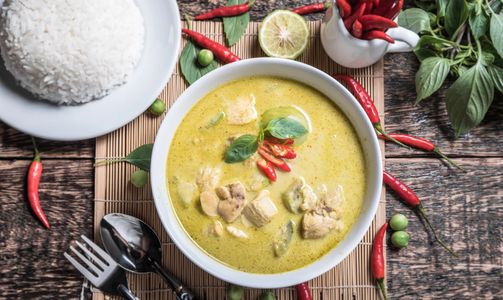 Chicken green curry together with steamed rice. Unique and favorite Thai dish of many.