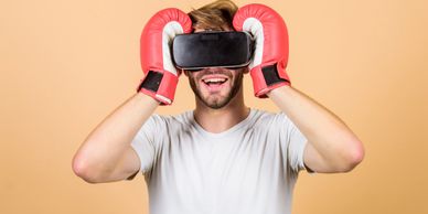 Boxing enthusiast wearing virtual reality headset