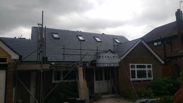 Slate roof installation with tiled gable and roof windows, Ridge Park, Bramhall