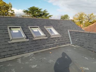 Spanish slate roof with three Velux windows and flat roof section, Moss Lane, Bramhall