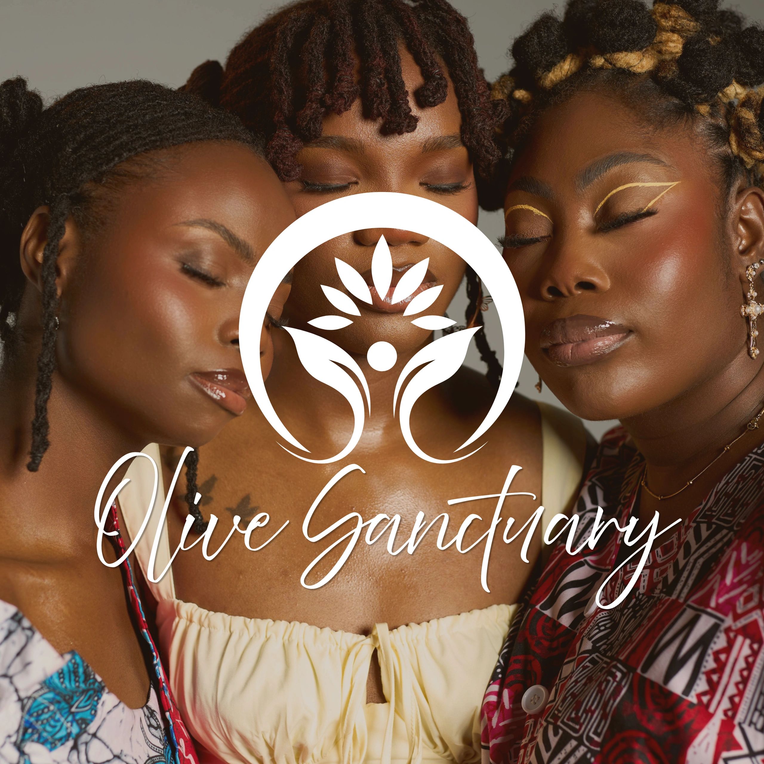 Three women with closed eyes embracing each other warmly.