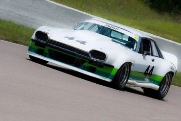 A white and green race car