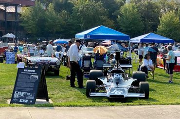 A group of people at a car show