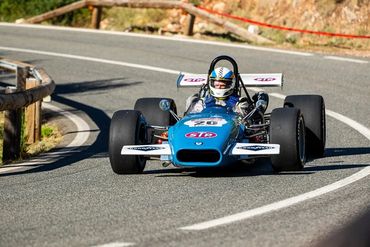 A race car driving down a curvy road