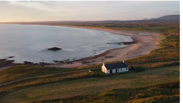 Traigh Cottage and view of the beach and sea