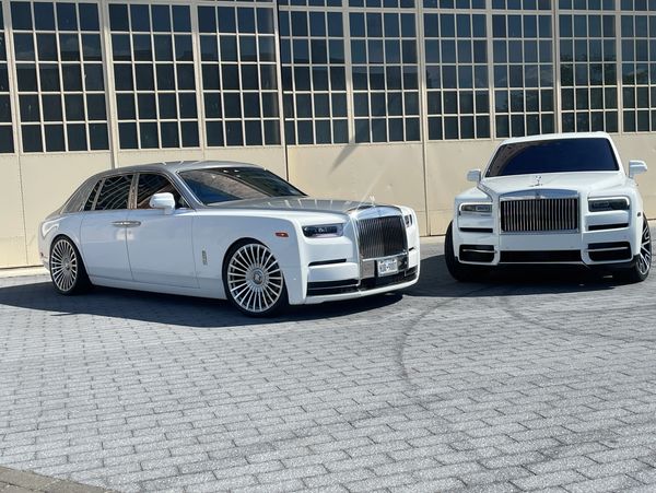 Picture of our fleet featuring our Rolls Royce Phantom and Rolls Royce Cullinan.