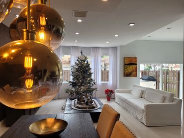 Custom made drapery in white linen. Custom made sofa in linen inspired by Restauration Hardware.