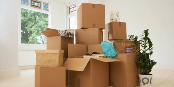 A picture of packing boxes inside the house