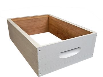 A wooden box with white painted exterior and natural wood interior.