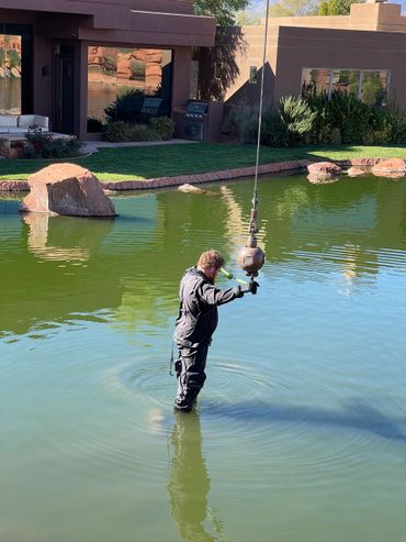 crane and diver removing pump