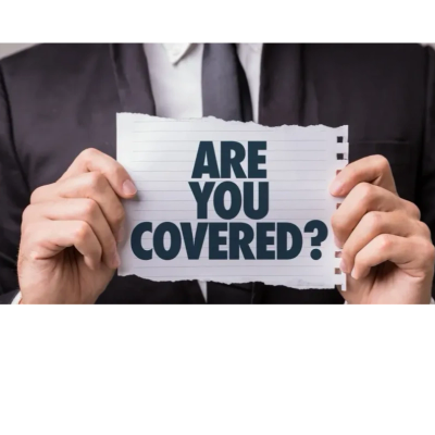 Person holding a paper with 'ARE YOU COVERED?' text.